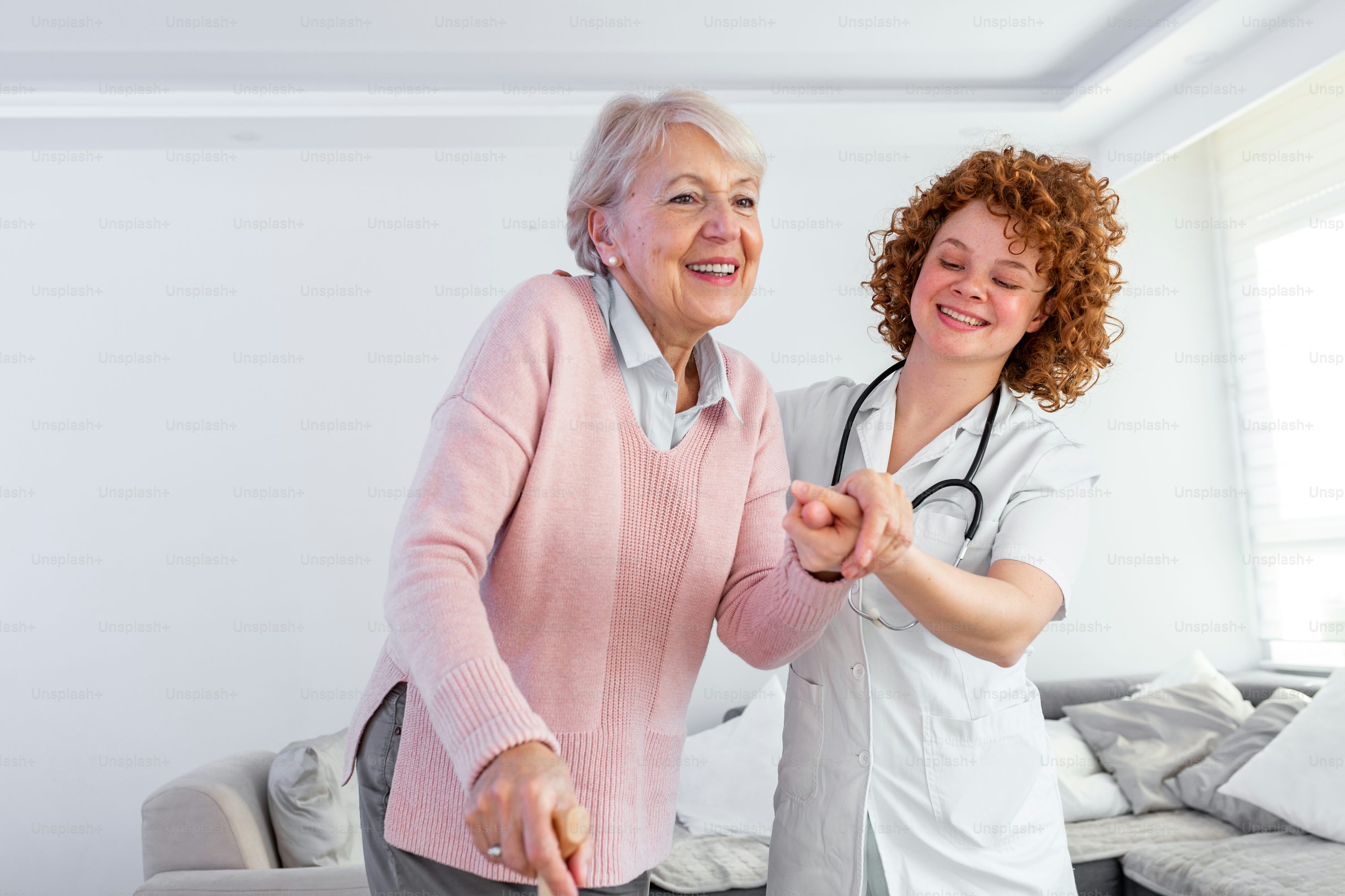 Caregiver supporting senior patient with mobility assistance